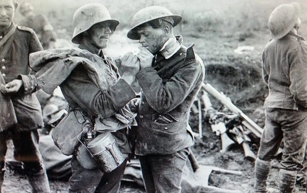 <b>Fig 14.</b> Two soldiers in World War I sharing a moment of respite on the battlefield during the Christmas truce of December 24–26, 1914.
